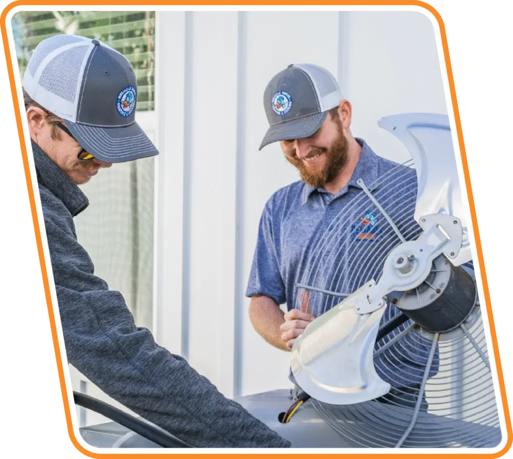 Reliable Ducts technician installing a new heating system in a Jacksonville home
