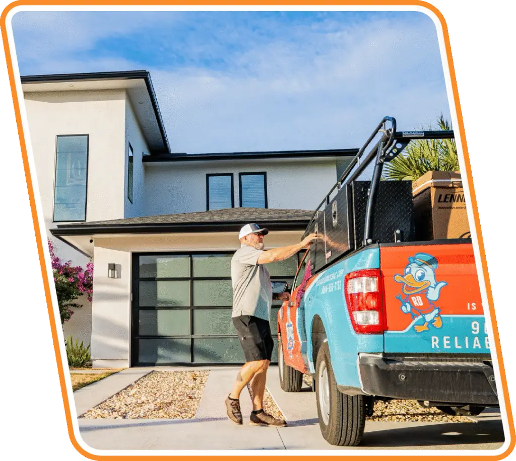 Reliable Ducts HVAC technician unloading service truck at a Jacksonville home