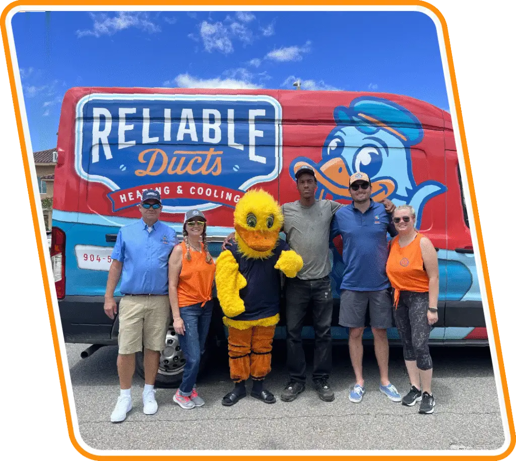 Reliable Ducts Heating & Cooling team and mascot with branded service van in St. Augustine, FL