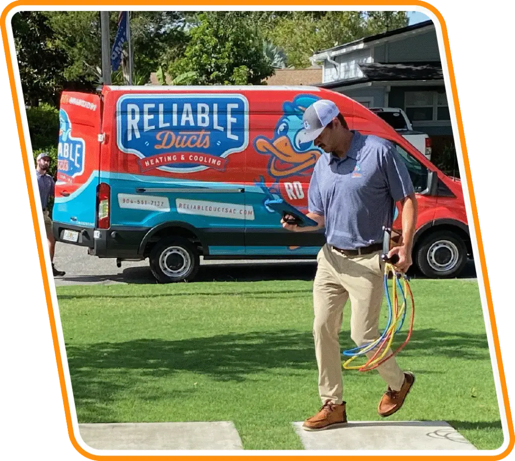 Reliable Ducts HVAC technician with tools walking from branded service van to a Neptune Beach home for air conditioning service.
