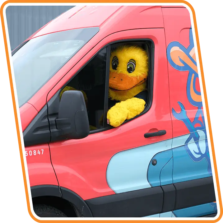 Reliable Ducts Heating & Cooling mascot driving company service van in Fernandina Beach, FL.
