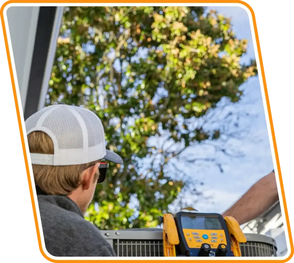 Technician performing AC maintenance and diagnostic testing on outdoor unit in San Marco, FL.